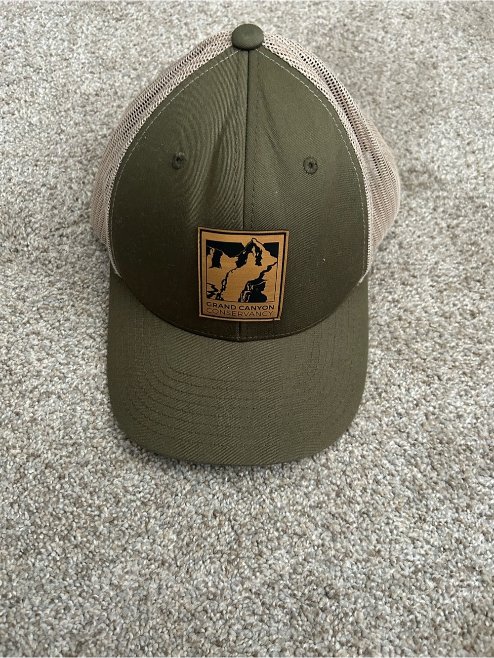 Grand Canyon Conservancy tan and green trucker hat